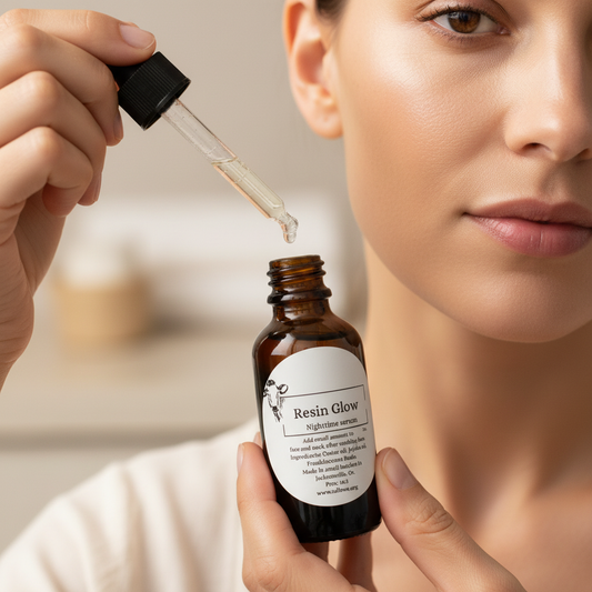 Person applying Resin Glow serum